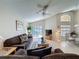 Bright living room with a comfortable seating area and access to the outdoor pool at 2649 Hemingway Ave, Haines City, FL 33844