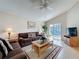 Spacious living room with comfortable seating and a sliding glass door to the backyard at 2649 Hemingway Ave, Haines City, FL 33844