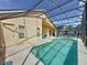 Inviting screened-in pool featuring clear blue water and a spacious deck for outdoor enjoyment at 2649 Hemingway Ave, Haines City, FL 33844