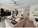Spacious living room with plush seating, tile flooring, and an open layout at 2735 Scarborough Dr, Kissimmee, FL 34744