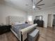 Spacious main bedroom featuring a large bed, neutral colors, and tiled floors at 2735 Scarborough Dr, Kissimmee, FL 34744