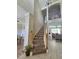 Carpeted staircase with wooden handrails leads to the second floor, with views of the dining and living areas at 2735 Scarborough Dr, Kissimmee, FL 34744
