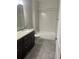 Bathroom with granite countertop vanity, subway tile surround, and modern fixtures at 2813 Roseglen Way, Orlando, FL 32812