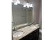 Bathroom featuring double sinks, granite countertops, tile floors, and a shower at 2813 Roseglen Way, Orlando, FL 32812