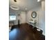 Inviting entryway with dark hardwood floors, modern lighting, and stylish decor at 2813 Roseglen Way, Orlando, FL 32812
