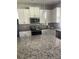 Granite countertops with stainless steel appliances and white cabinets at 2813 Roseglen Way, Orlando, FL 32812
