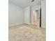 Neutral carpeted bedroom featuring a door leading to the rest of the house at 2839 Harmonia Hammock Rd, Harmony, FL 34773