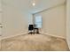 Neutral carpeted bedroom featuring a window and minimal furnishings at 2839 Harmonia Hammock Rd, Harmony, FL 34773
