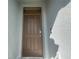 Close-up view of the front door, showing modern hardware and a secure entry system at 2839 Harmonia Hammock Rd, Harmony, FL 34773