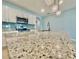 Close-up of kitchen island with granite countertops and modern faucet at 2839 Harmonia Hammock Rd, Harmony, FL 34773