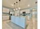 Stylish kitchen with stainless steel appliances and a spacious island at 2839 Harmonia Hammock Rd, Harmony, FL 34773