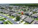 Aerial view of a residential neighborhood with a mix of houses and well-kept lawns at 2924 White Cedar Cir, Kissimmee, FL 34741