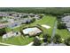 Aerial view features the community amenities: pool, playground, and sand volleyball court at 2924 White Cedar Cir, Kissimmee, FL 34741