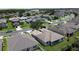 Aerial view of a well-maintained home, showcasing the neighborhood with manicured lawns at 2924 White Cedar Cir, Kissimmee, FL 34741