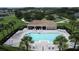 Aerial view of the sparkling community pool with plenty of lounge chairs for relaxing at 2924 White Cedar Cir, Kissimmee, FL 34741