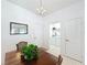 Cozy dining area featuring a wood table and view to laundry area at 2924 White Cedar Cir, Kissimmee, FL 34741