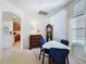 Cozy dining area with white walls, carpet, and classic wooden furniture at 2924 White Cedar Cir, Kissimmee, FL 34741