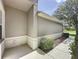 A partial view of a well-maintained home exterior with manicured landscaping at 2924 White Cedar Cir, Kissimmee, FL 34741