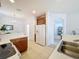 Bright kitchen with white appliances, wooden cabinets, and tile flooring at 2924 White Cedar Cir, Kissimmee, FL 34741