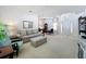 Spacious living room with carpet flooring, bright lighting, and an inviting seating area at 2924 White Cedar Cir, Kissimmee, FL 34741