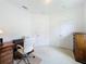 Spacious home office furnished with a desk, chair, and wooden cabinet with light carpet at 2924 White Cedar Cir, Kissimmee, FL 34741