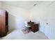 Bright office space features a wooden desk, comfortable chair, and built-in shelving at 2924 White Cedar Cir, Kissimmee, FL 34741