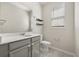 Stylish bathroom featuring a modern vanity, mirror, and shelving providing a comfortable and functional space at 2966 Aqua Virgo Loop # 16, Orlando, FL 32837