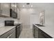 Well-equipped kitchen featuring sleek appliances, quartz countertops, and an efficient layout at 2966 Aqua Virgo Loop # 16, Orlando, FL 32837