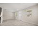 Open concept living space with tile floors, bright neutral paint, and large windows to let in plenty of light at 2966 Aqua Virgo Loop # 16, Orlando, FL 32837