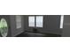 Open-concept living room featuring wood-look floors, many windows and an inviting front door at 3029 Azalea Ave, Lake Wales, FL 33898