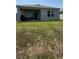 Private backyard with covered patio, ideal for entertaining and enjoying the serene outdoor setting at 30346 Armenia Rd, Leesburg, FL 34748