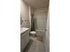 A well-maintained bathroom showcasing a vanity, toilet, and a shower-tub with a neutral color scheme at 30346 Armenia Rd, Leesburg, FL 34748