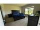 Inviting bedroom with a window view, comfortable bed, and modern furnishings offering relaxation and style at 30346 Armenia Rd, Leesburg, FL 34748