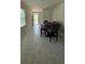 Dining area featuring tiled flooring and a modern dining table set at 30346 Armenia Rd, Leesburg, FL 34748