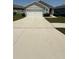 Charming single-story home featuring a spacious driveway and a well-maintained lawn at 30346 Armenia Rd, Leesburg, FL 34748