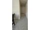 Clean hallway with tiled flooring leading to various rooms in the house at 30346 Armenia Rd, Leesburg, FL 34748