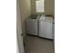 Compact laundry area equipped with a side-by-side washer and dryer setup for efficient cleaning at 30346 Armenia Rd, Leesburg, FL 34748