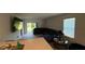 Cozy living area with sliding glass doors leading to backyard and comfortable seating at 30346 Armenia Rd, Leesburg, FL 34748