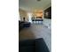 Spacious open-concept living area with view of the kitchen and breakfast bar at 30346 Armenia Rd, Leesburg, FL 34748