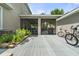 Outdoor deck and screened in porch for relaxing and grilling; lush landscaping at 3310 Cat Brier Trl, Harmony, FL 34773