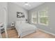 Bright bedroom with two windows, and a comfortable queen size bed at 3310 Cat Brier Trl, Harmony, FL 34773