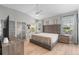 Spacious bedroom with vaulted ceiling, large bed, and two windows for natural light at 3310 Cat Brier Trl, Harmony, FL 34773