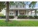 Charming two-story home with a welcoming front porch and manicured lawn at 3310 Cat Brier Trl, Harmony, FL 34773