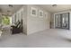 Spacious covered front porch with sitting area and direct access into the house at 3310 Cat Brier Trl, Harmony, FL 34773