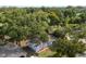 Charming home surrounded by lush greenery and mature trees, offering a serene and private setting with a well manicured exterior at 410 Kentia Rd, Casselberry, FL 32707