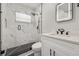 Modern bathroom with walk-in shower, stylish tile, and sleek vanity at 410 Kentia Rd, Casselberry, FL 32707