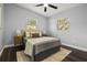 Cozy bedroom with natural light, ceiling fan, and neutral color palette, creating a serene space at 410 Kentia Rd, Casselberry, FL 32707