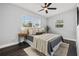 Bedroom with a ceiling fan, hardwood floors, and plenty of natural light at 410 Kentia Rd, Casselberry, FL 32707