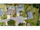 Aerial view showcasing the property's boundaries, pool, and location in a well-landscaped neighborhood at 415 Smiley Ct, Winter Haven, FL 33884