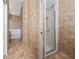 Ensuite bathroom with a walk-in shower and a large soaking tub at 415 Smiley Ct, Winter Haven, FL 33884